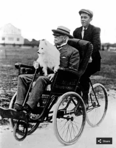 Fotoserie Flagler, Henry Flagler with Delos sitting on his lap in a popular bicycle-mounted wicker wheel chair conveyance of Gilded Age Palm Beach